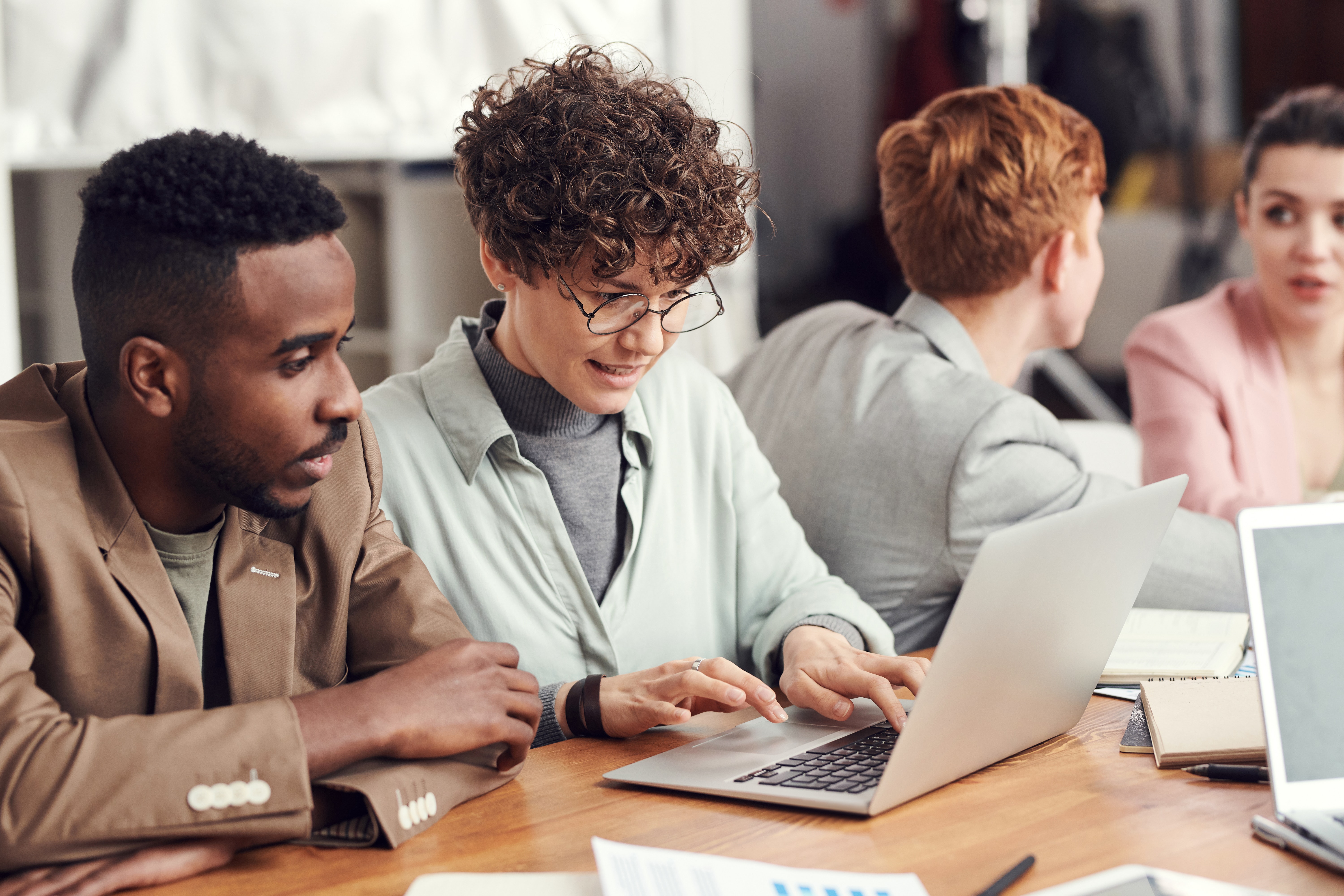 Man and woman looking at laptop