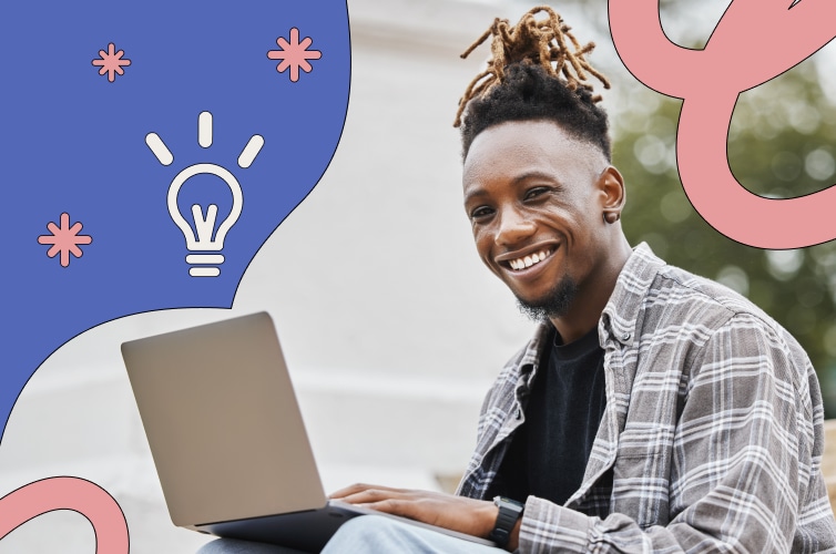 Man working on his laptop and smiling