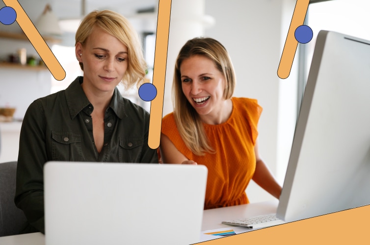 Two women looking at laptop