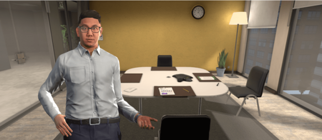 Man standing in an empty meeting room, in front of a desk and empty chairs