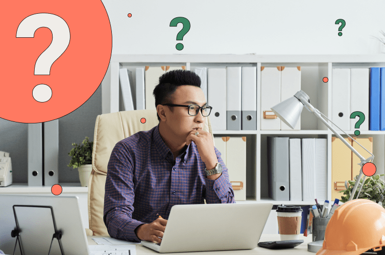 Worker sitting at desk with question mark graphics