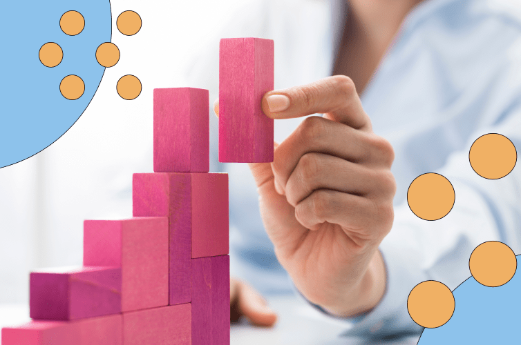 Person stacking blocks in a staircase shape