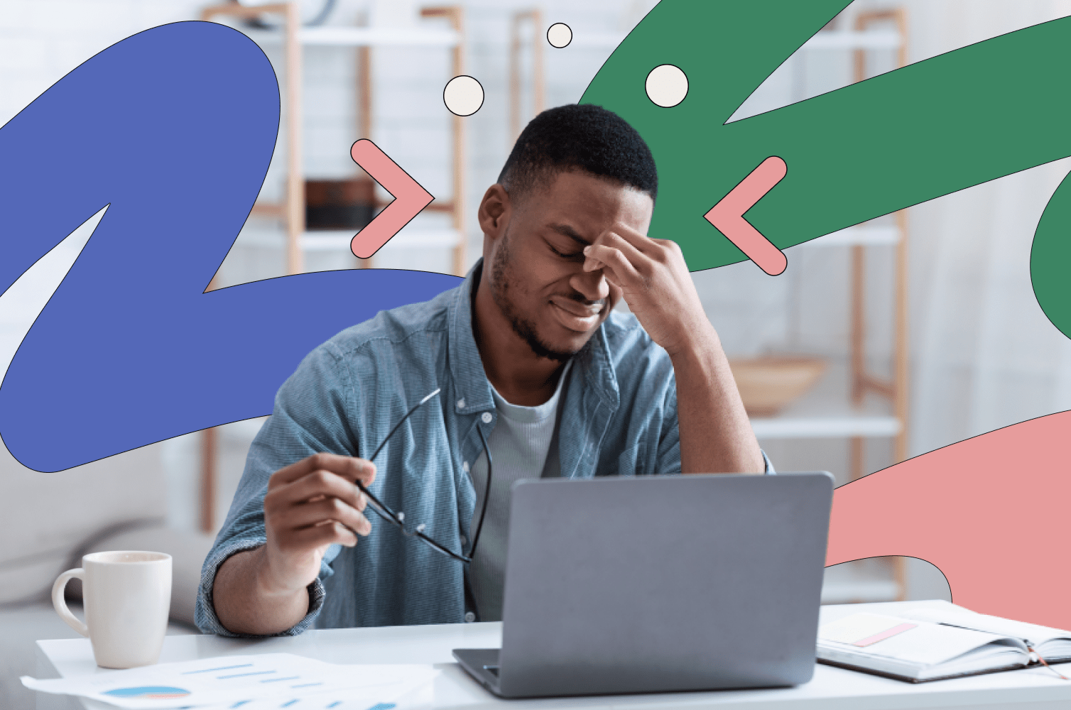 Man sitting in front of a laptop with his hand on his face, looking frustrated